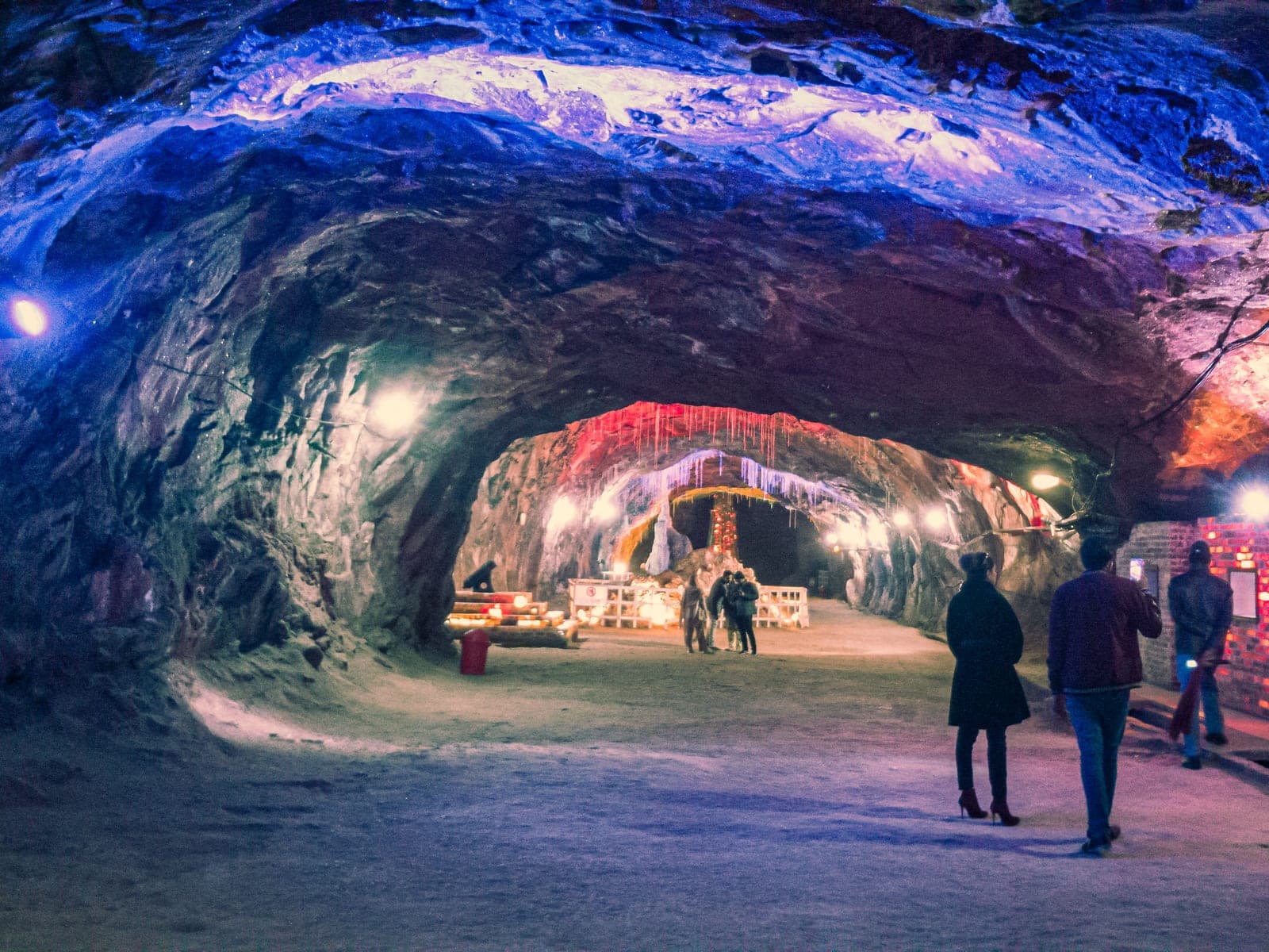 A tunnel inside the Khewra Salt Mine, its walls carved from pink rock salt
